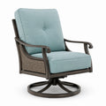 Fauteuil pivotant en aluminium et rotin avec coussins en tissu bleu